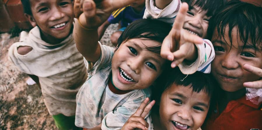 A beautiful sunset over a calm ocean with vibrant orange and pink hues reflecting on the water.